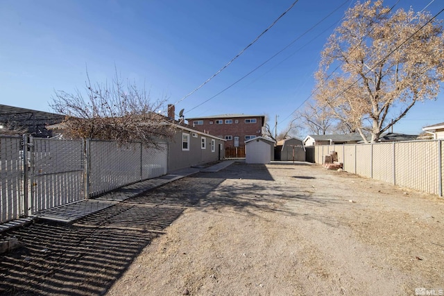 rear view of property featuring a shed