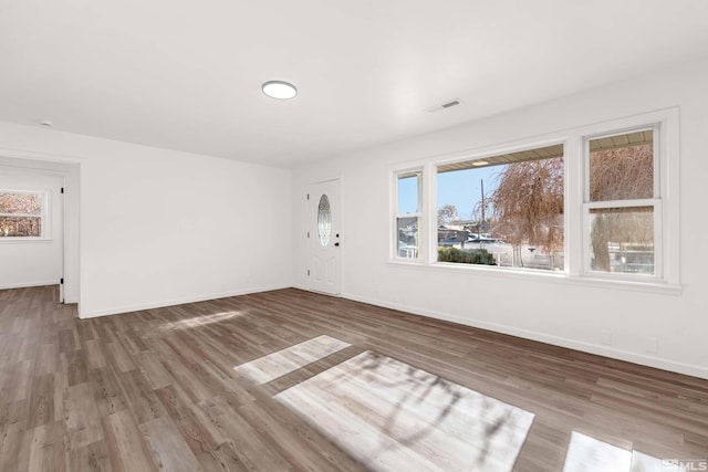 spare room featuring hardwood / wood-style floors