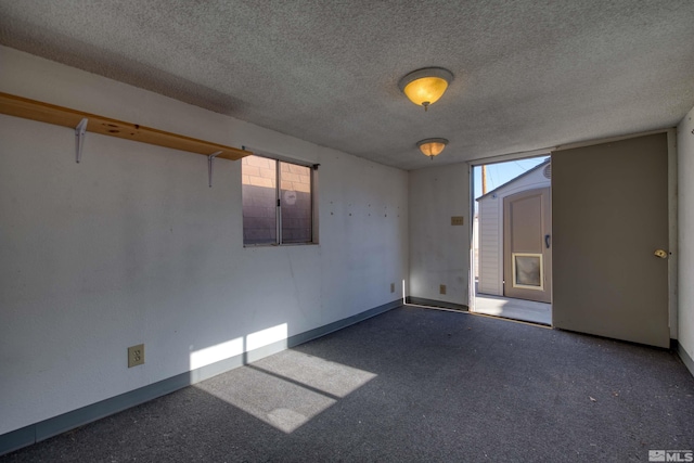 empty room featuring a textured ceiling