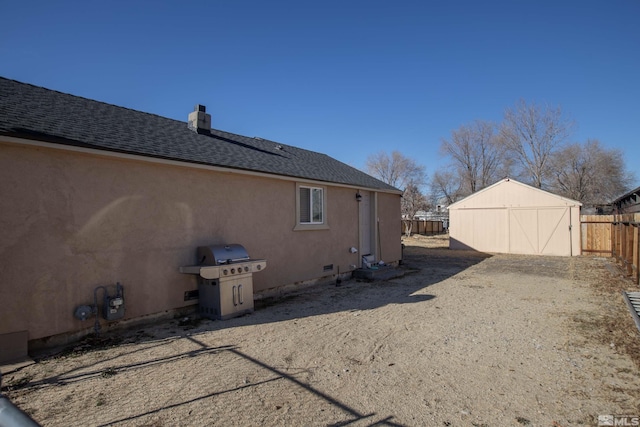 view of side of home with an outbuilding