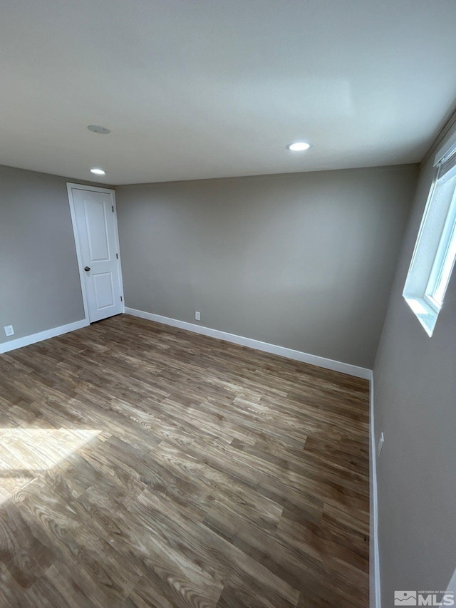 empty room featuring dark hardwood / wood-style floors