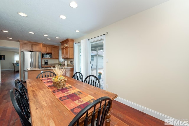 dining area featuring dark hardwood / wood-style flooring