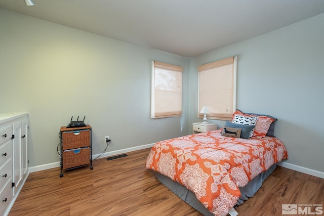 bedroom with light hardwood / wood-style flooring