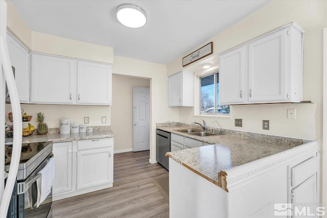 kitchen with white cabinetry, sink, stainless steel appliances, and light hardwood / wood-style floors