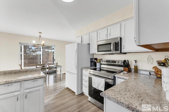 kitchen with white cabinetry, stainless steel appliances, light hardwood / wood-style flooring, a notable chandelier, and decorative light fixtures