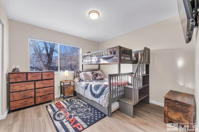 bedroom with light wood-type flooring