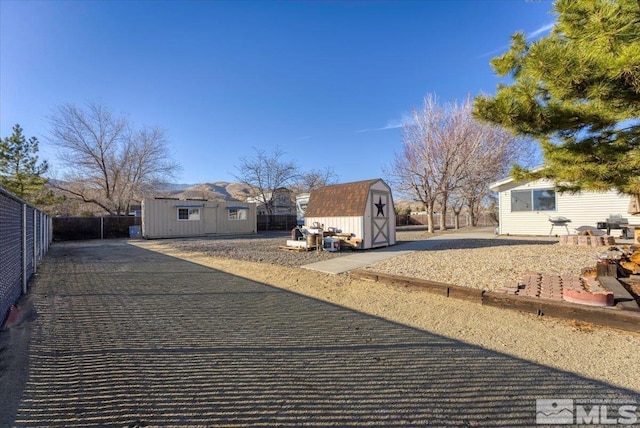 view of front facade featuring a storage shed