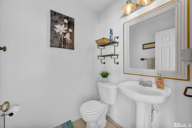 bathroom featuring tile patterned floors and toilet