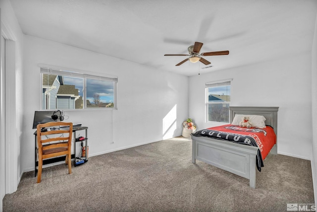 bedroom with ceiling fan and carpet floors