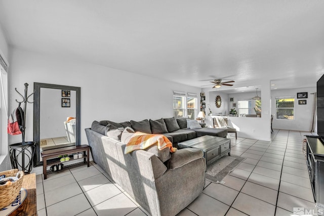 tiled living room featuring ceiling fan