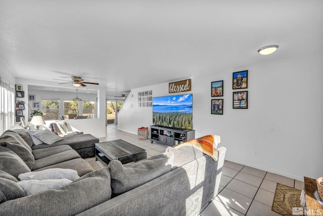 tiled living room with ceiling fan