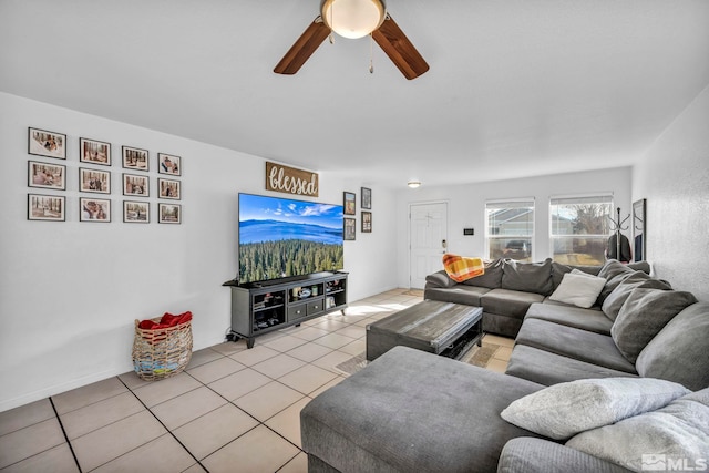 living room featuring ceiling fan and light tile patterned flooring