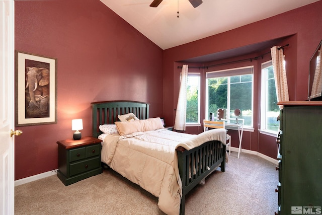 bedroom featuring ceiling fan, light colored carpet, and lofted ceiling