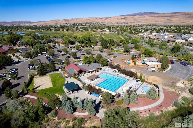 birds eye view of property featuring a mountain view