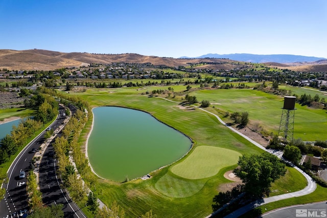 birds eye view of property featuring a water and mountain view