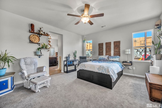 carpeted bedroom with ceiling fan