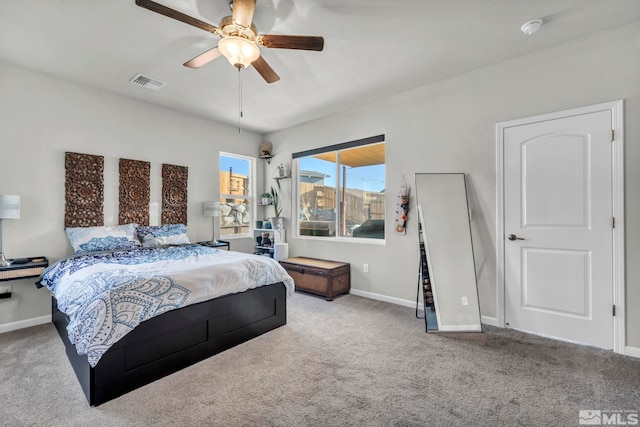 carpeted bedroom with ceiling fan