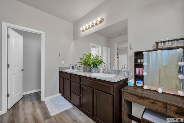 bathroom featuring hardwood / wood-style floors and vanity