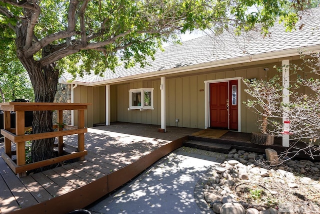 entrance to property featuring a deck