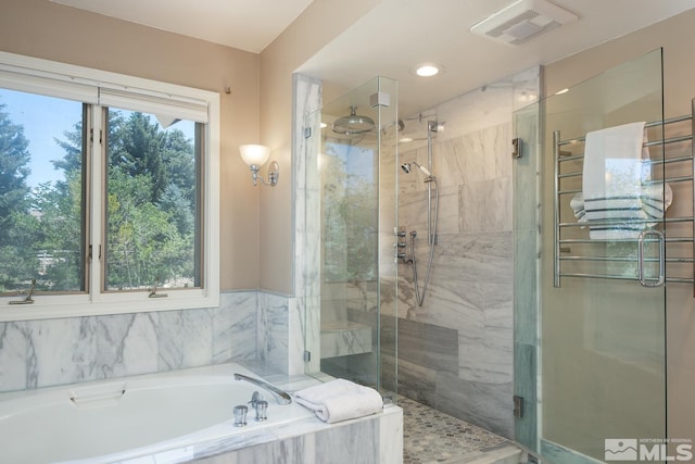 bathroom featuring plus walk in shower