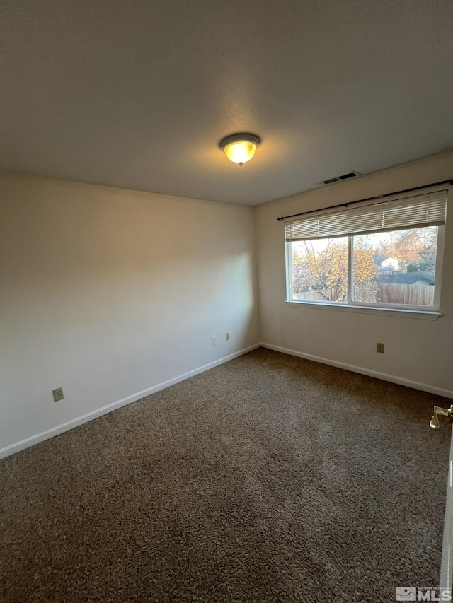 unfurnished room featuring carpet floors