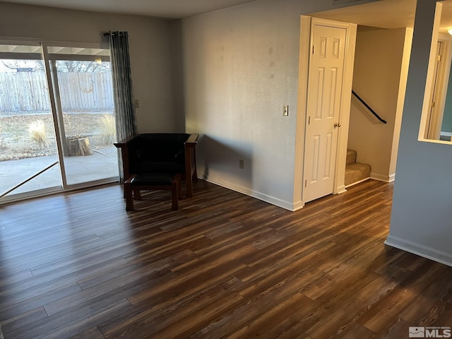 unfurnished room featuring dark hardwood / wood-style flooring