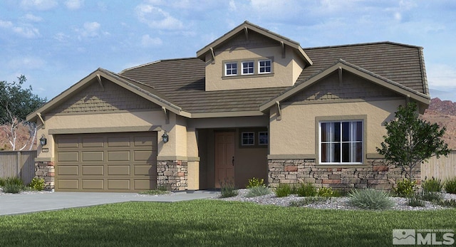 craftsman house featuring a garage and a front yard