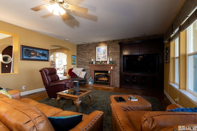 living room with hardwood / wood-style flooring, ceiling fan, and a wealth of natural light