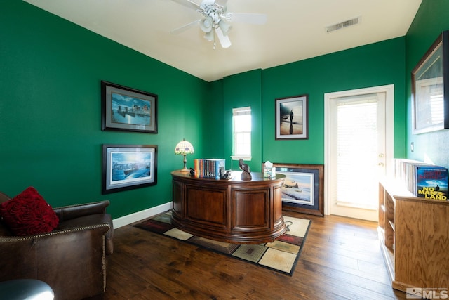 office area with ceiling fan and dark hardwood / wood-style flooring