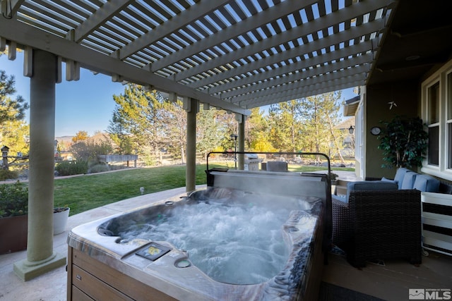 view of patio / terrace featuring a pergola and a hot tub