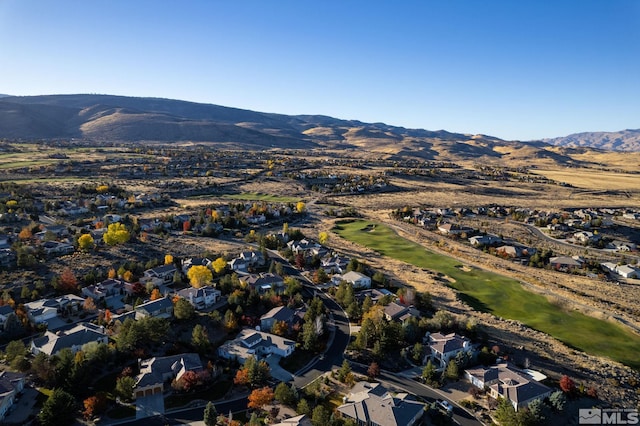 birds eye view of property with a mountain view