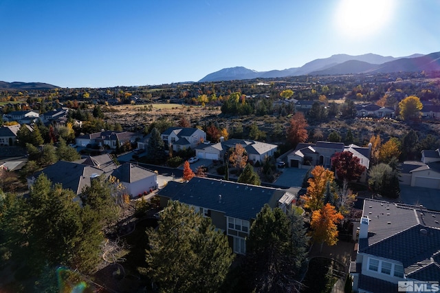 birds eye view of property with a mountain view