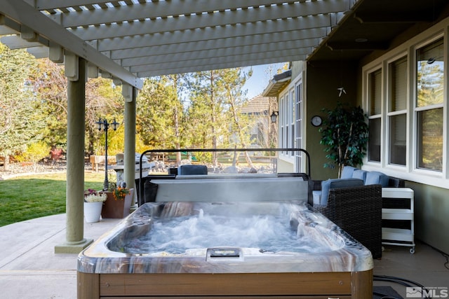 view of patio / terrace featuring a pergola and a hot tub