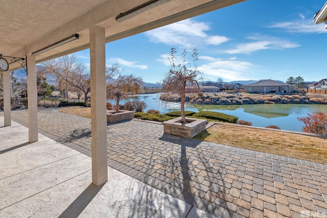 view of patio featuring a water view