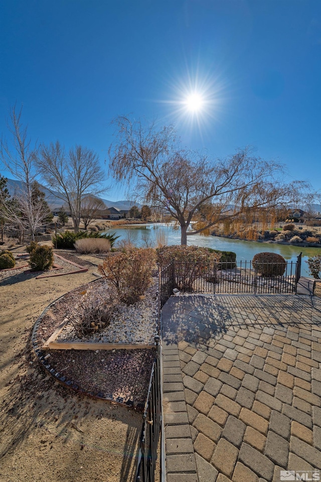 view of patio / terrace with a water view