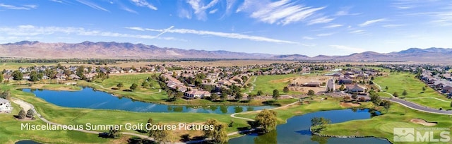 aerial view featuring a water and mountain view