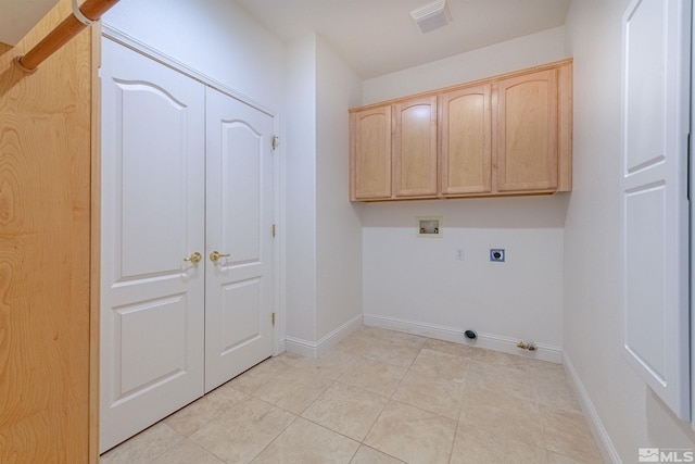 clothes washing area with cabinets, washer hookup, light tile patterned floors, and hookup for an electric dryer