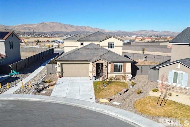 ranch-style house featuring a mountain view and a garage