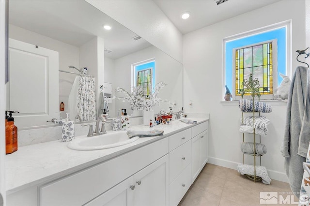 bathroom featuring tile patterned floors, vanity, and a shower with shower curtain