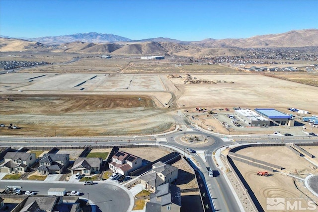 birds eye view of property with a mountain view