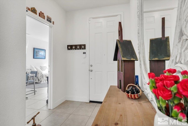 entrance foyer with light tile patterned floors