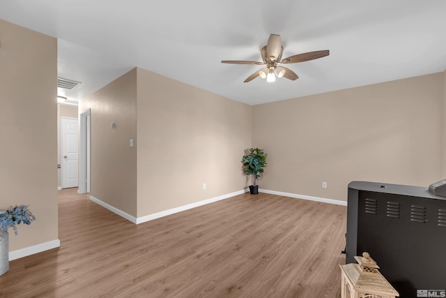 unfurnished room featuring ceiling fan and light hardwood / wood-style floors