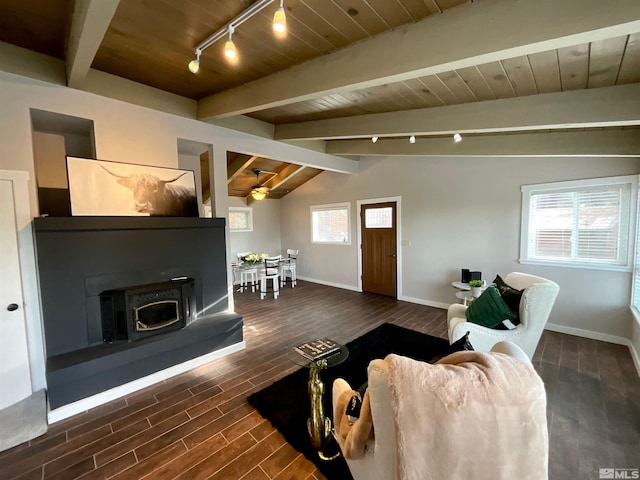 living room featuring vaulted ceiling with beams, ceiling fan, dark hardwood / wood-style flooring, and a wealth of natural light