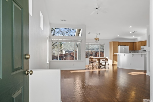 living room with ceiling fan and hardwood / wood-style flooring