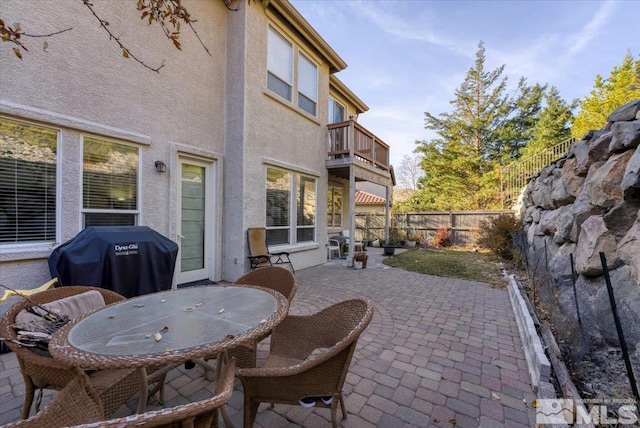 view of patio with a balcony and grilling area