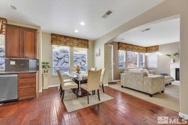 dining area with dark hardwood / wood-style floors