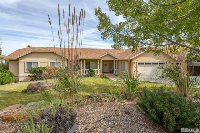 single story home featuring a front lawn and a garage