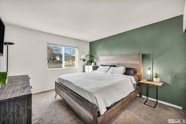 bedroom with light colored carpet