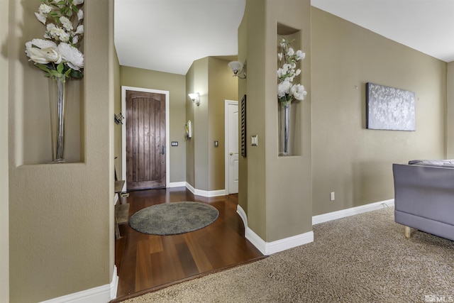 foyer with dark hardwood / wood-style flooring