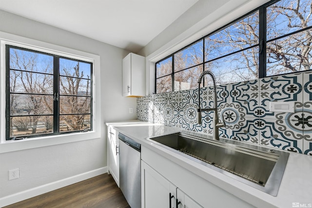 kitchen featuring dishwasher, white cabinets, and dark hardwood / wood-style floors